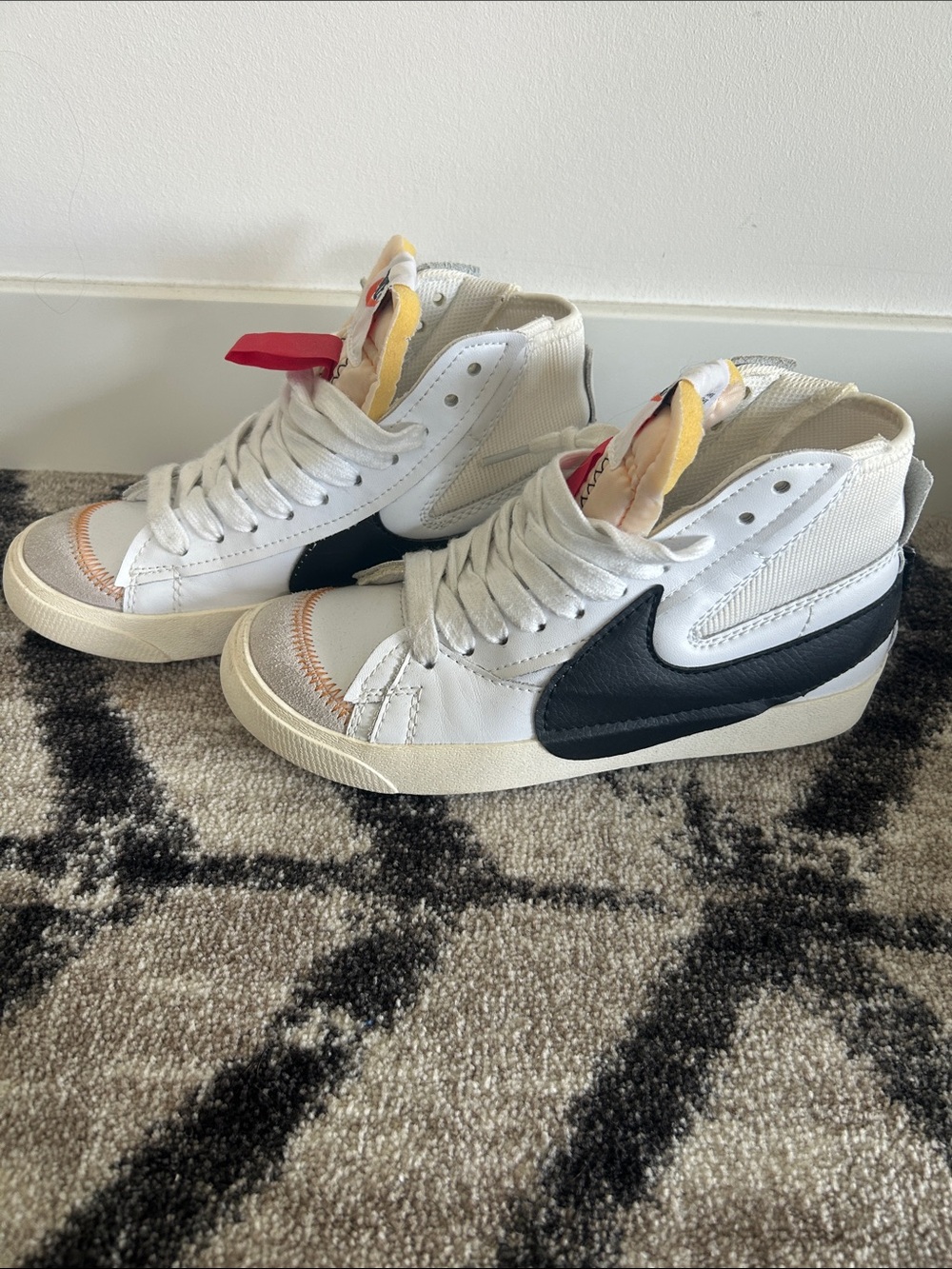 Nike White High-Top Sneakers with Black Swoosh Accents
